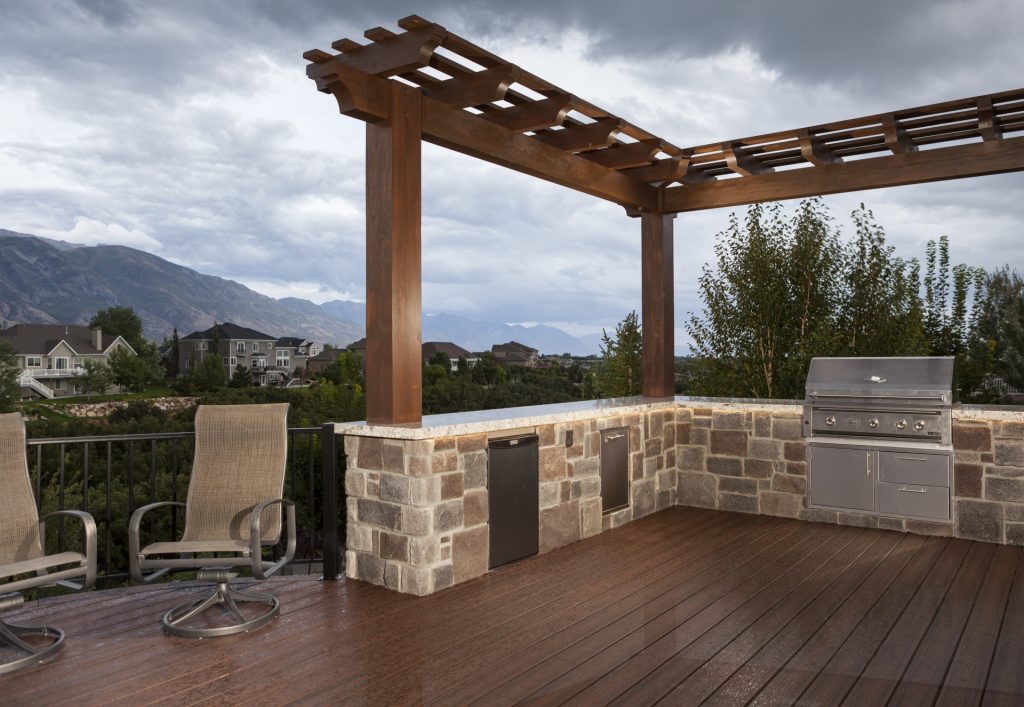 Stone and timber outdoor kitchen pergola built for a Golden residence