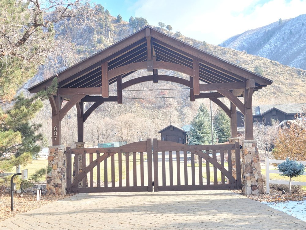 Our timber frame gates attached to the front outdoor timber entrance for an install