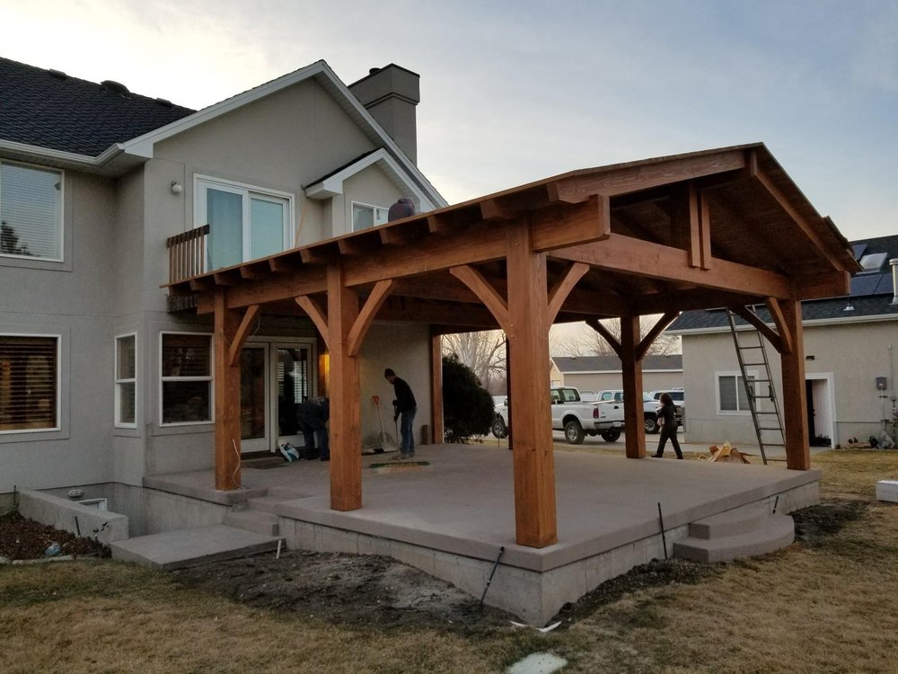 Our team installing a wooden patio pergola in a residential neighborhood