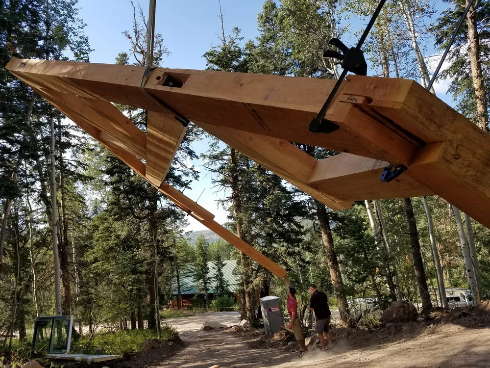 One of our heavy timber frames being installed with our team onsite
