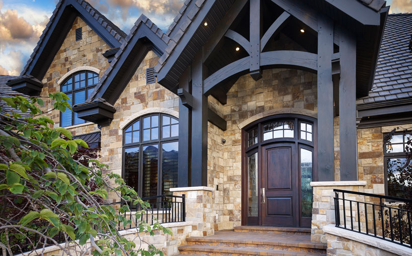 Front entrance of a house with custom outdoor timber beams to elevate the design