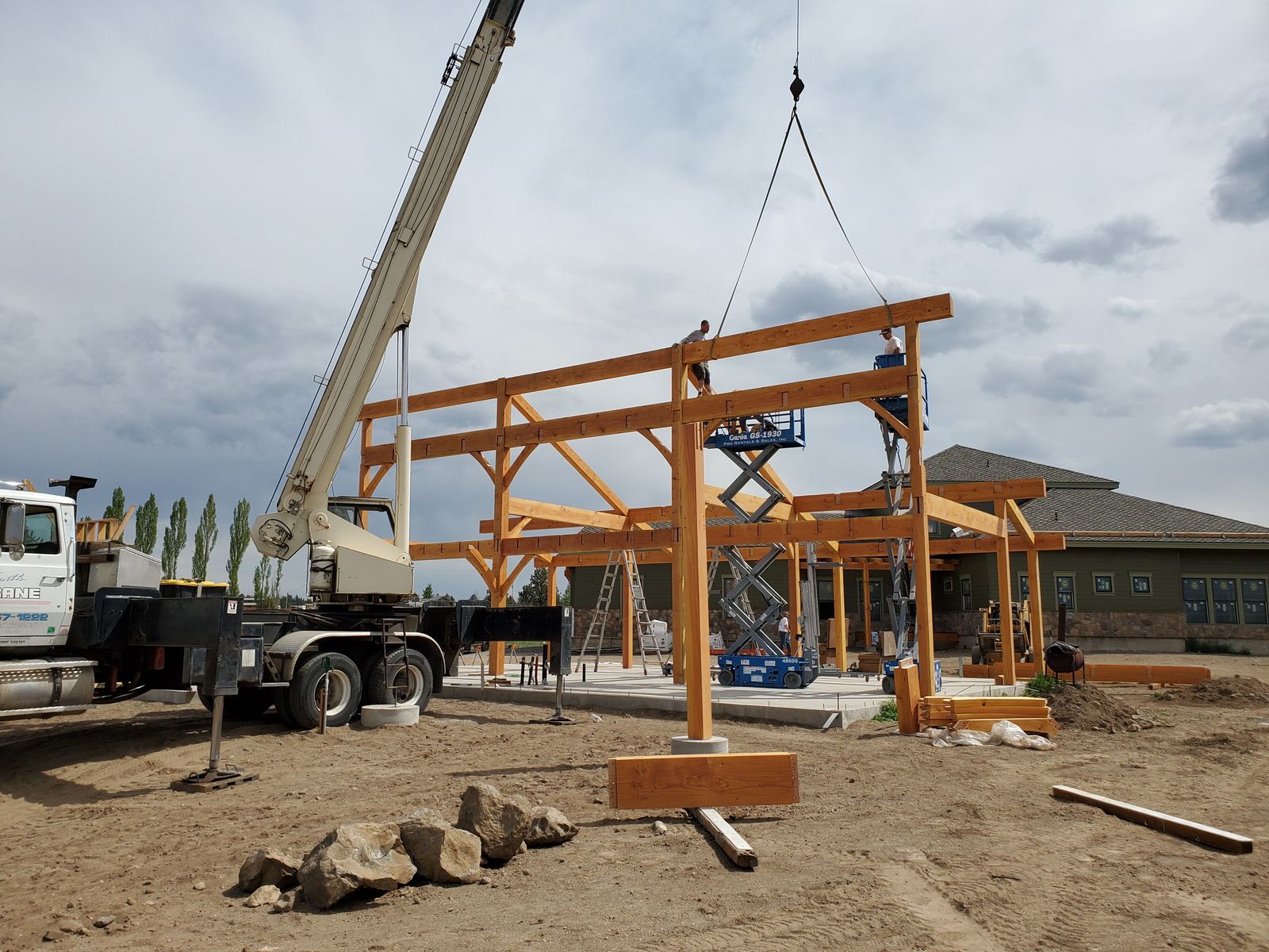 Team installing a timber frame on site