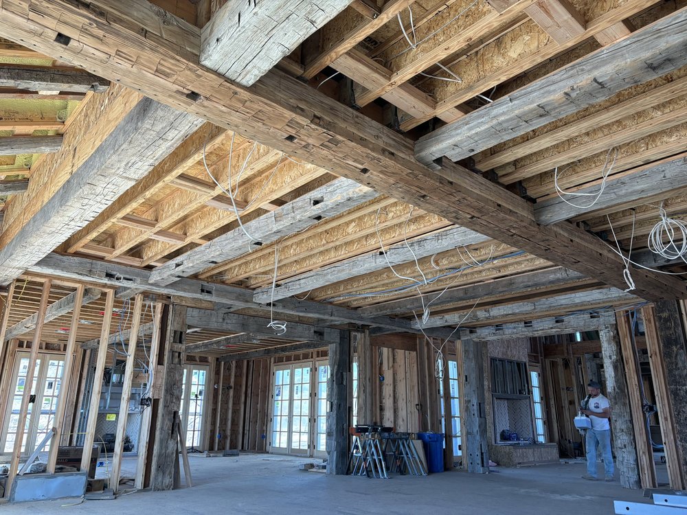 Interior of a house under construction, showing our exposed refurnished timber beams, being used on this project