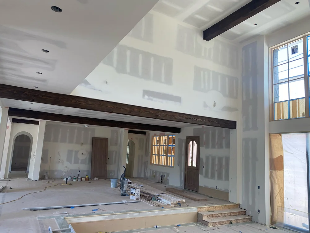 Interior of a house under construction with exposed timber beams