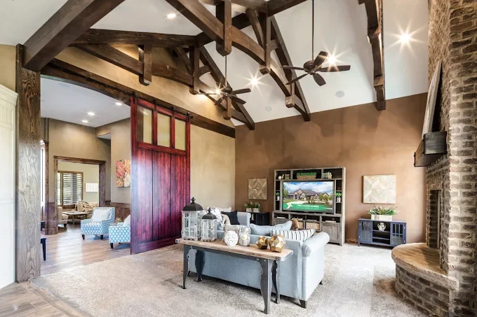 Living room with exposed wooden timber beams and furnished space